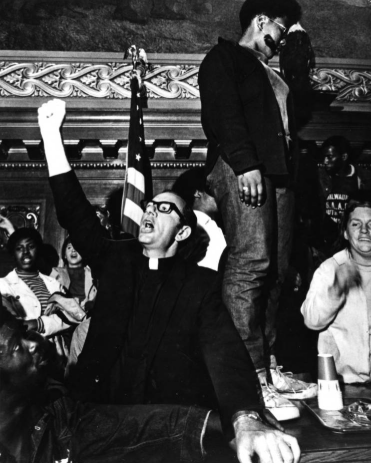 Father James Groppi and supporters in the Assembly Parlor